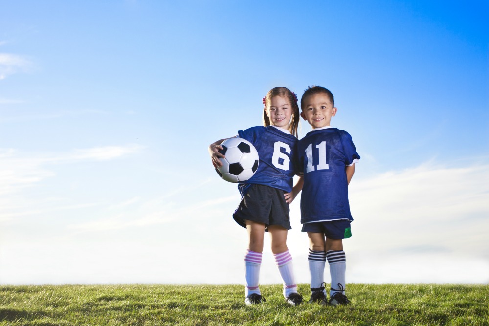 Kids playing soccer discount